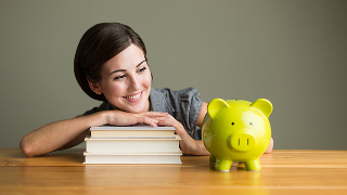 Two female students working together at one laptop